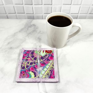These Kaffee Fassett fabric mug rugs are also known as drink coasters.  They are made from 100% cotton, are insulated and washable.  These are great accessories for your home office desk or for your coffee bar area, adding a splash of color and uniqueness.