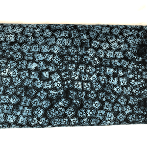 This navy and light blue floral print batik fabric is 100% cotton material.  The high quality batiks sold by Sew Happy Quilting is sure to impress. Many love to purchase these fabrics to create quilts or to just add to their fabric stash.