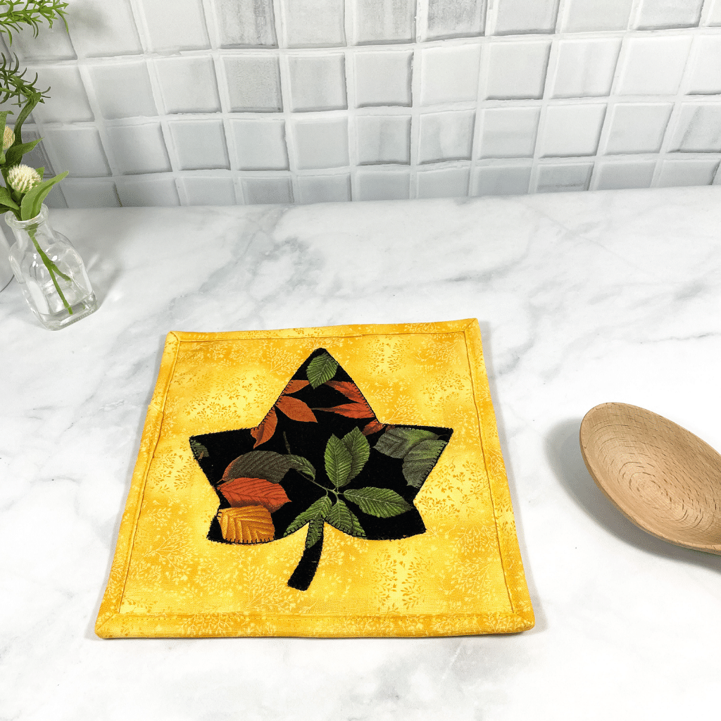 These are maple leaf themed quilted potholders for your home.  The trivets are made from 100% cotton fabric and are washable.  Practical, yet beautiful when used as hot pads on your kitchen island or dining table.