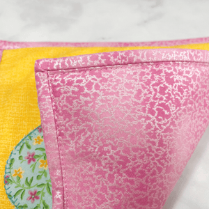 This flower applique potholder is stunning with it's yellow, pink and aqua fabric.  Each Sew Happy Quilting potholder is triple stitched at the edges, washable and highly unique.  Give one of these to your favorite baker or cook and they are sure to smile.
