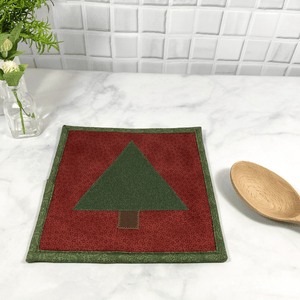 These are gorgeous Christmas tree themed quilted potholders for your home.  The trivets are made from 100% cotton fabric and are washable.  Practical, yet beautiful when used as hot pads on your kitchen island or dining table.