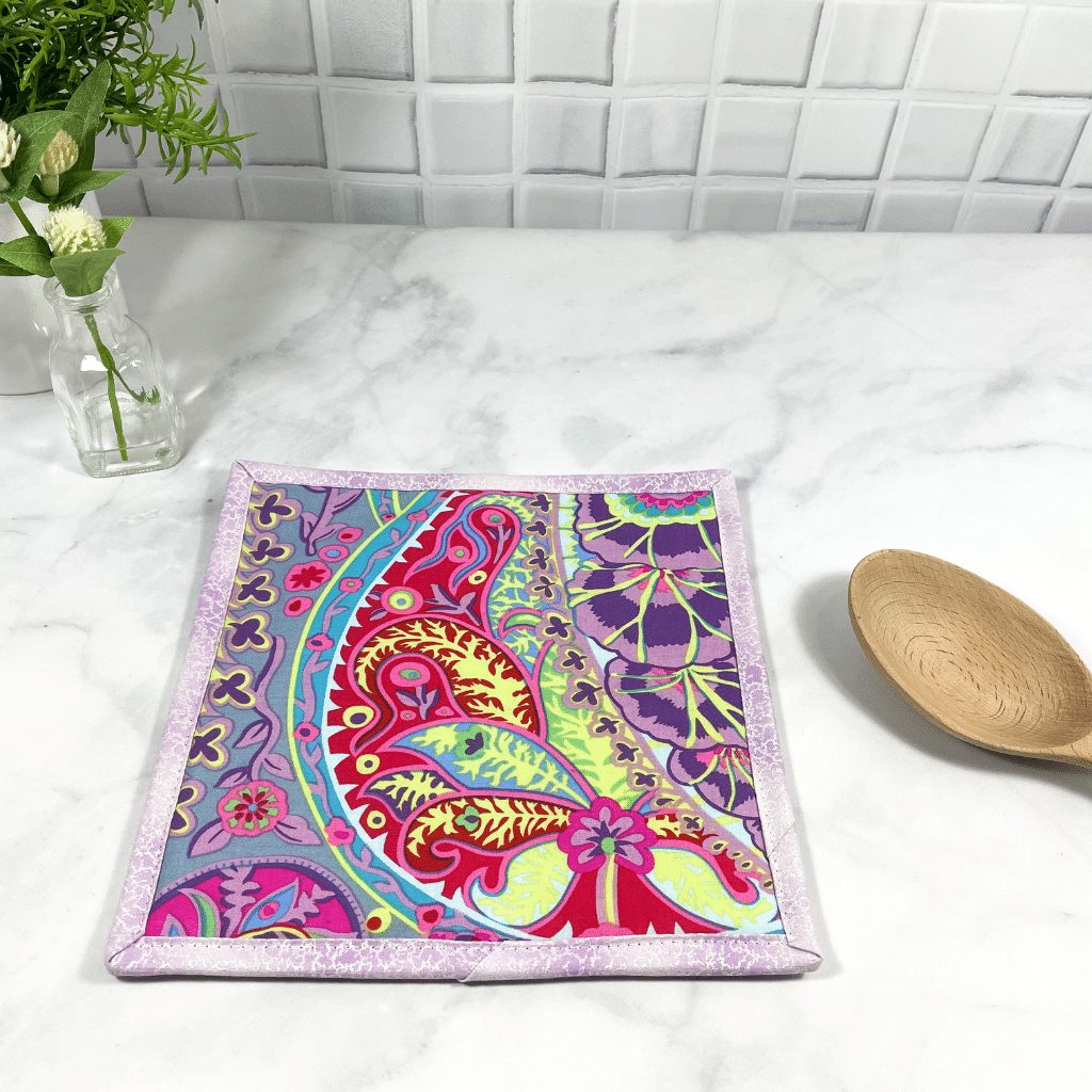 These are gorgeous Kaffe Fassett paisley jungle themed quilted potholders for your home.  The trivets are made from 100% cotton fabric and are washable.  Practical, yet beautiful when used as hot pads on your kitchen island or dining table.