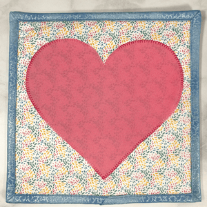 These are gorgeous pink and blue heart themed quilted potholders for your home.  The trivets are made from 100% cotton fabric and are washable.  Practical, yet beautiful when used as hot pads on your kitchen island or dining table.