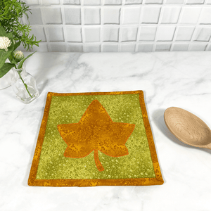 These are gorgeous orange and green maple leaf quilted potholders for your home.  The trivets are made from 100% cotton fabric and are washable.  Practical, yet beautiful when used as hot pads on your kitchen island or dining table.