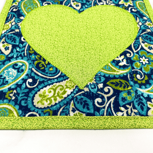 These are gorgeous green and blue heart quilted potholders for your home.  The trivets are made from 100% cotton fabric and are washable.  Practical, yet beautiful when used as hot pads on your kitchen island or dining table.
