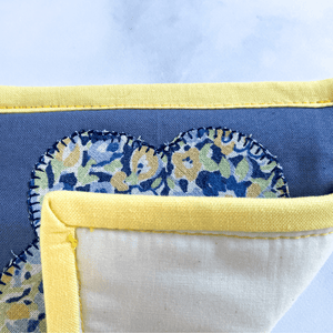 These are yellow and blue flower applique mug rugs. Mug rugs are also known as drink coasters.  They are made from 100% cotton fabric, are insulated and washable too.  These are great accessories for your home office desk or for your coffee bar area, adding a splash of color and uniqueness.