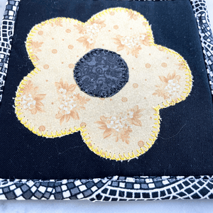 These black and yellow floral applique mug rugs make a great gift for that coffee lover in your life.  Each drink coaster is made from 100% cotton, has insulated batting and is hand crafted in the USA.