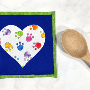These paw print themed potholders will add a fun splash of color to your kitchen.  These trivets are insulated and great for protecting hands and countertops.  Pot holders make great gifts for the baker or cook in your life.  And these dog themed ones will make any dog lover swoon!