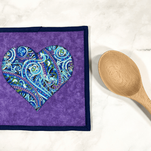 These purple and navy paisley themed potholders have a gorgeous heart applique on the front.  It's a great addition to that modern kitchen island area and practical for removing hot dishes from the oven.  These pot holders make a great gift for the baker, chef or cook in your life.  Many love making kitchen gift baskets with these included.