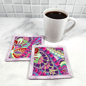 These Kaffee Fassett fabric mug rugs are also known as drink coasters.  They are made from 100% cotton, are insulated and washable.  These are great accessories for your home office desk or for your coffee bar area, adding a splash of color and uniqueness.