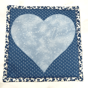 These are gorgeous blue and white quilted potholders with an applique heart in the center.  The trivets are a great addition to your kitchen and are made from 100% cotton fabric and washable too.  Practical yet beautiful when used as hot pads on your kitchen island or dining table.
