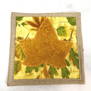 This is a single mug rug aka drink coaster that has a maple leaf applique design on the front.  It measures 5 by 5 inches, is insulated, and washable.  It make a great gift for a coffee lover.  And adds a special flair to any home coffee bar or office desk.