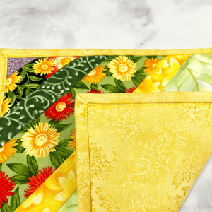 These are gorgeous flower themed quilted potholders for your home.  The trivets are made from 100% cotton fabric and are washable.  Practical, yet beautiful when used as hot pads on your kitchen island or dining table.