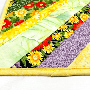 These are gorgeous flower themed quilted potholders for your home.  The trivets are made from 100% cotton fabric and are washable.  Practical, yet beautiful when used as hot pads on your kitchen island or dining table.
