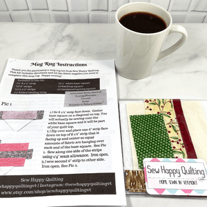 If you love craft kits, check out this quilt kit that will teach you how to make a fabric mug rug aka drink coaster.  Each kit comes with fabric plus printed directions and are mailed to your door.  This one is made with red, green and brown fabric.