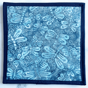 This gorgeous blue fabric potholder is made with a dragonfly themed batik material.  The pot holder is insulated and makes a great trivet for your hot dishes.  It will protect your countertops and tables and makes a great gift for the baker or chef in your life.