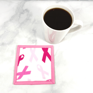 These pink and white cancer ribbon themed mug rugs aka drink coasters make a great gift for that cancer breast cancer fighter in your life.  She is sure to smile when she uses it while she sips her coffee or tea.  They are 100% cotton, washable and insulated.