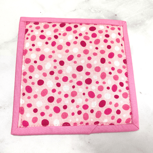 These pink and white cancer ribbon themed mug rugs aka drink coasters make a great gift for that cancer breast cancer fighter in your life.  She is sure to smile when she uses it while she sips her coffee or tea.  They are 100% cotton, washable and insulated.