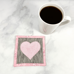 Heart themed mug rugs are also known as drink coasters.  They are made from 100% cotton fabric, are insulated and washable too.  These are great accessories for your home office desk or for your coffee bar area, adding a splash of color and uniqueness.