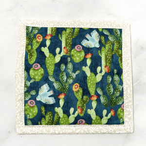 Mug rugs are also known as drink coasters. They are made from 100% cotton fabric, are insulated and washable too. These are great accessories for your home office desk or for your coffee bar area. This particular one is made with a gorgeous blue and green cactus print fabric.