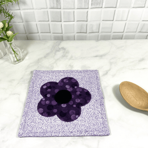 These are gorgeous purple flower quilted potholders for your home.  The trivets are made from 100% cotton fabric and are washable.  Practical, yet beautiful when used as hot pads on your kitchen island or dining table.