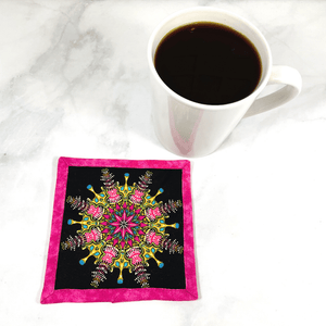 This pink and black mandala patterned mug rug aka drink coaster is so colorful.  It will make a great addition to your coffee table or desk at the office.  These make great gifts paired with the recipient's favorite wine or coffee.