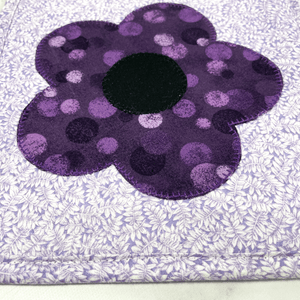 These are gorgeous purple flower quilted potholders for your home.  The trivets are made from 100% cotton fabric and are washable.  Practical, yet beautiful when used as hot pads on your kitchen island or dining table.