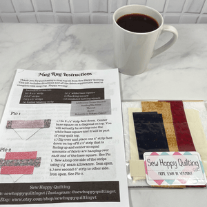 If you love craft kits, check out this quilt kit that will teach you how to make a fabric mug rug aka drink coaster.  Each kit comes with fabric plus printed directions and are mailed to your door.  This one is made with red, blue and yellow fabric.