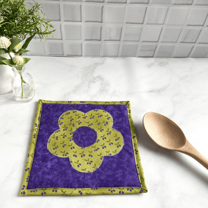 This is a gorgeous cottagecore themed fabric potholder made from 100% cotton green and purple fabrics.  These trivets are great for your hot dishes and will protect your kitchen island and dining room table.  Click to see more pot holders.