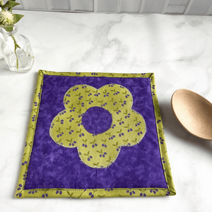 This is a gorgeous cottagecore themed fabric potholder made from 100% cotton green and purple fabrics.  These trivets are great for your hot dishes and will protect your kitchen island and dining room table.  Click to see more pot holders.