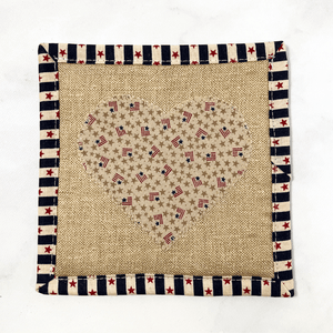 Mug rugs are also known as drink coasters.  They are made from 100% cotton fabric, are insulated and washable too.  These are great accessories for your home office desk or for your coffee bar area.  This particular one has an Americana theme with a heart applique made from small flag fabric.