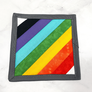 This rainbow mug rug aka drink coaster is such a stunning fabric accessory.  It makes such a great gift for the coffee or wine lover in your live.  It's an accessory that can be used on your table or desk and it looks so darn pretty!