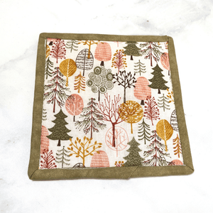 This fun tree themed mug rug is made with strips of fabrics in shades of light pink and mint green.  These mug rugs make great gifts for your coworker or your friend who has everything.   They are insulated, washable and made from 100% cotton.