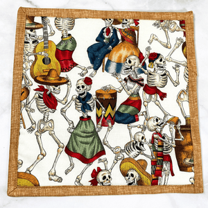 These are gorgeous day of the dead aka día de los muertos quilted potholders for your home.  The trivets are made from 100% cotton fabric and are washable.  Practical, yet beautiful when used as hot pads on your kitchen island or dining table.