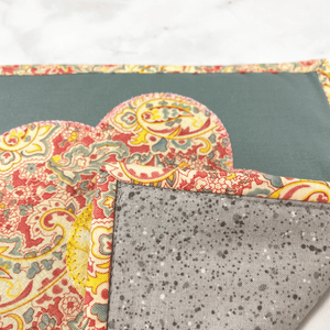 These are gorgeous gray, pink and yellow flower themed quilted potholders for your home.  The trivets are made from 100% cotton fabric and are washable.  Practical, yet beautiful when used as hot pads on your kitchen island or dining table.