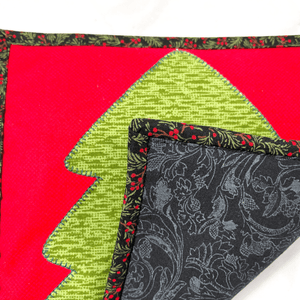 If you are looking for a gorgeous Christmas holiday accessory for your kitchen, check out the quilted potholders made by Sew Happy Quilting.  Each one is unique and special and make a great gift for the chef or baker in your life.  Trivets are great to protect your hands as well as your dining room table.