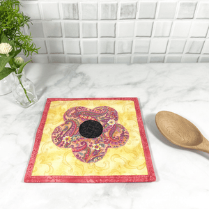 These are gorgeous pink and yellow flower quilted potholders for your home.  The trivets are made from 100% cotton fabric and are washable.  Practical, yet beautiful when used as hot pads on your kitchen island or dining table.