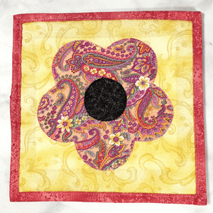 These are gorgeous pink and yellow flower quilted potholders for your home.  The trivets are made from 100% cotton fabric and are washable.  Practical, yet beautiful when used as hot pads on your kitchen island or dining table.