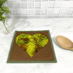 These are gorgeous brown and green heart quilted potholders for your home.  The trivets are made from 100% cotton fabric and are washable.  Practical, yet beautiful when used as hot pads on your kitchen island or dining table.
