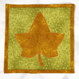 These are gorgeous orange and green maple leaf quilted potholders for your home.  The trivets are made from 100% cotton fabric and are washable.  Practical, yet beautiful when used as hot pads on your kitchen island or dining table.