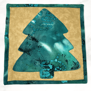 These are gorgeous green and brown Christmas tree quilted potholders for your home.  The trivets are made from 100% cotton fabric and are washable.  Practical, yet beautiful when used as hot pads on your kitchen island or dining table.