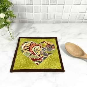 These are gorgeous heart themed quilted potholders for your home.  The trivets are made from 100% cotton fabric and are washable.  Practical, yet beautiful when used as hot pads on your kitchen island or dining table.