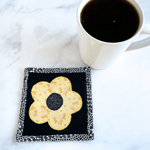 These black and yellow floral applique mug rugs make a great gift for that coffee lover in your life.  Each drink coaster is made from 100% cotton, has insulated batting and is hand crafted in the USA.
