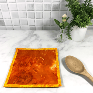 These are gorgeous quilted potholders for your home.  The trivets are made from 100% cotton fabric and are washable.  Practical, yet beautiful when used as hot pads on your kitchen island or dining table.  Yellow and Orange batik fabric was used for this pot holder.