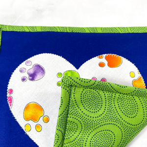 These paw print themed potholders will add a fun splash of color to your kitchen.  These trivets are insulated and great for protecting hands and countertops.  Pot holders make great gifts for the baker or cook in your life.  And these dog themed ones will make any dog lover swoon!