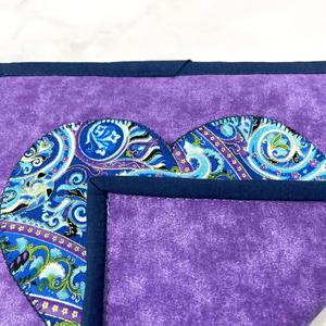 These purple and navy paisley themed potholders have a gorgeous heart applique on the front.  It's a great addition to that modern kitchen island area and practical for removing hot dishes from the oven.  These pot holders make a great gift for the baker, chef or cook in your life.  Many love making kitchen gift baskets with these included.